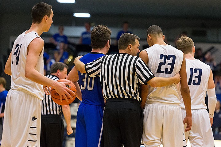 &lt;p&gt;Referee Paul Manzardo has a word with a couple of players after a skirmish on the court.&lt;/p&gt;