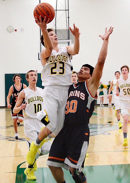 <p>Whitefish senior EJ Havens (23) goes up for two during the first half of the game against Plains on Friday, January 17, in Whitefish. (Brenda Ahearn/Daily Inter Lake)</p>