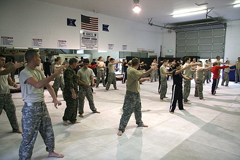 &lt;p&gt;Idaho National Guard trainees listen to instructions from Col. Michael Foley on Sunday at the Hand-to-Hand Combat Training Center in Post Falls.&lt;/p&gt;