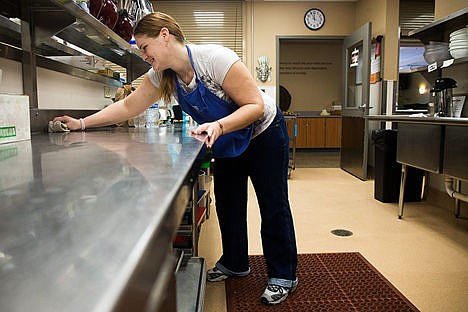 &lt;p&gt;Stefani Martin wipes down the counters of the kitchen at the Union Gospel Mission&#146;s Center for Women and Children on Friday morning. Martin has been a resident at Union Gospel Mission since April 2nd and has taken on responsibilities such as kitchen team leader and chore leader.&lt;/p&gt;