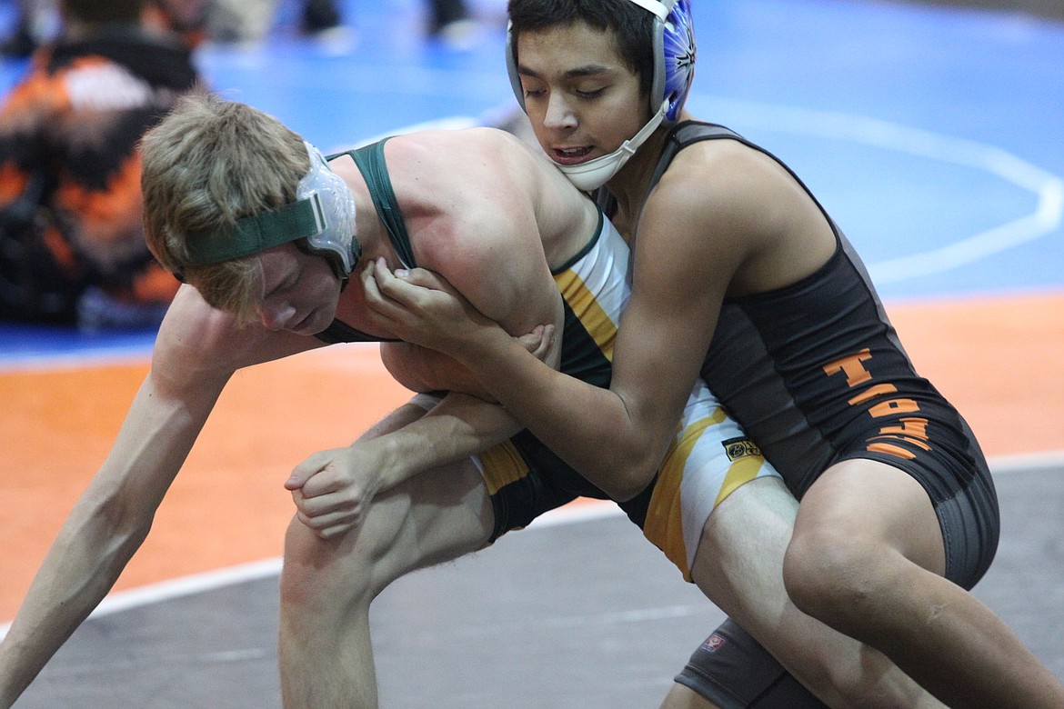 &lt;p&gt;MARK NELKE/Press&lt;/p&gt;&lt;p&gt;Mathias De La Rosa, right, of Post Falls, looks for control against Treyton Holman of Bonneville at 113 pounds in the semifinals of the River City Duals on Saturday at Post Falls High. De La Rosa won 12-0.&lt;/p&gt;