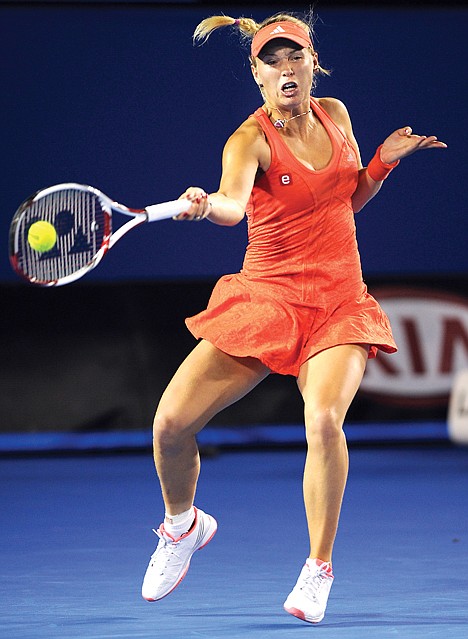 &lt;p&gt;Caroline Wozniacki of Denmark makes a forehand return to Anastasia Rodionova of Australia during their first round match at the Australian Open tennis championship, in Melbourne, Australia, Monday, Jan. 16, 2012. (AP Photo/Andrew Brownbill)&lt;/p&gt;