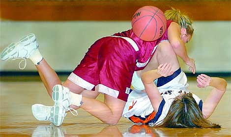 Chris Jordan/Daily Inter Lake&lt;br&gt;Flathead's Meghan O'Connell battles for a loose ball with Drew Mihelish of Helena High during the second half of Flathead's victory over the Bengals &lt;br&gt;Saturday night at FHS.