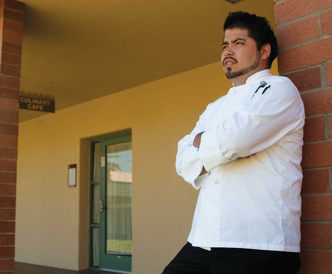 Lorenzo Santillan helps operate a catering service.