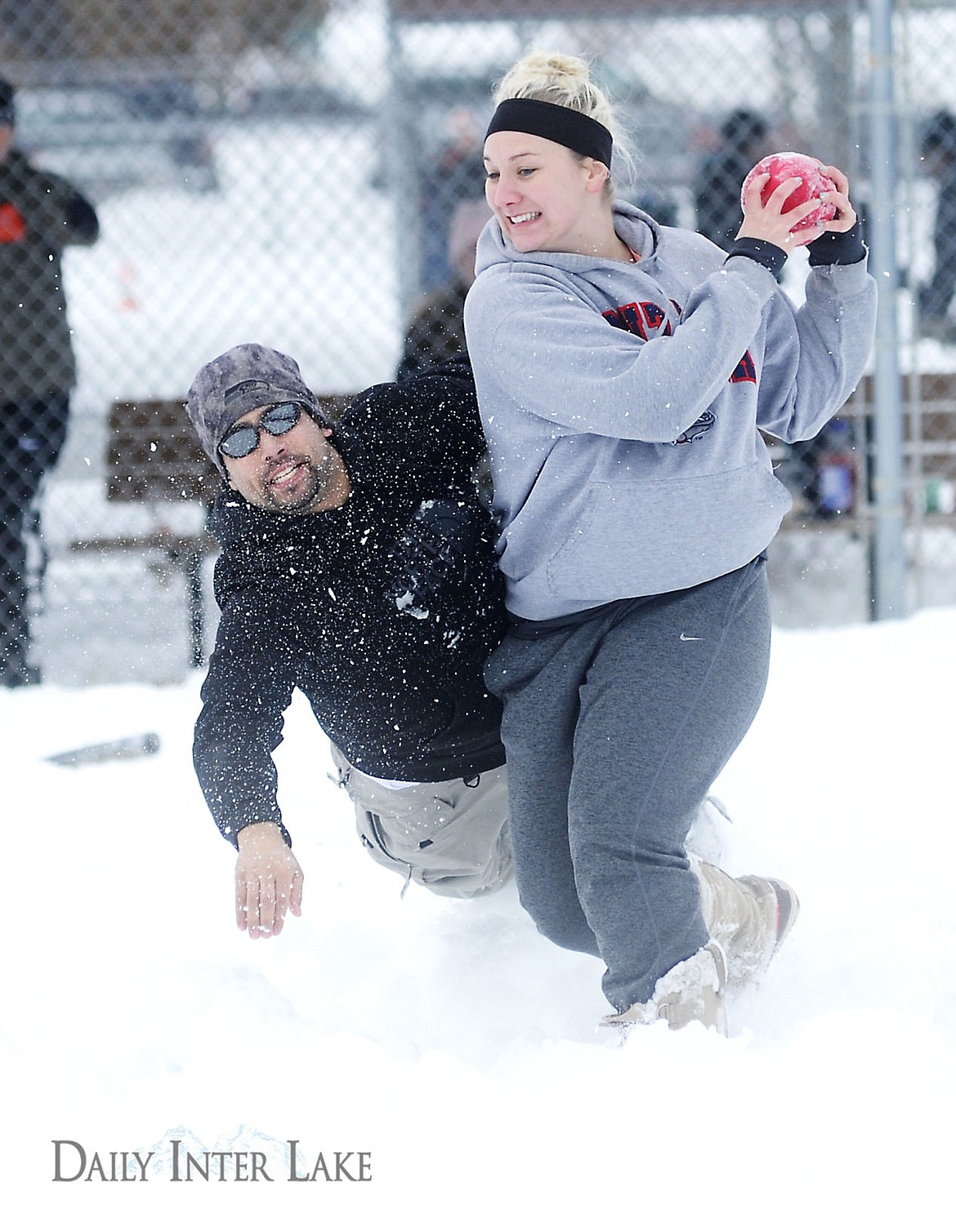 <p>Shay Grilley steals the ball away from Albert Hunt as he tries to tag her out during a game of softball at the Blizzard Bowl at the Conrad Complex on Saturday. Ten teams competed in the tournament.</p>