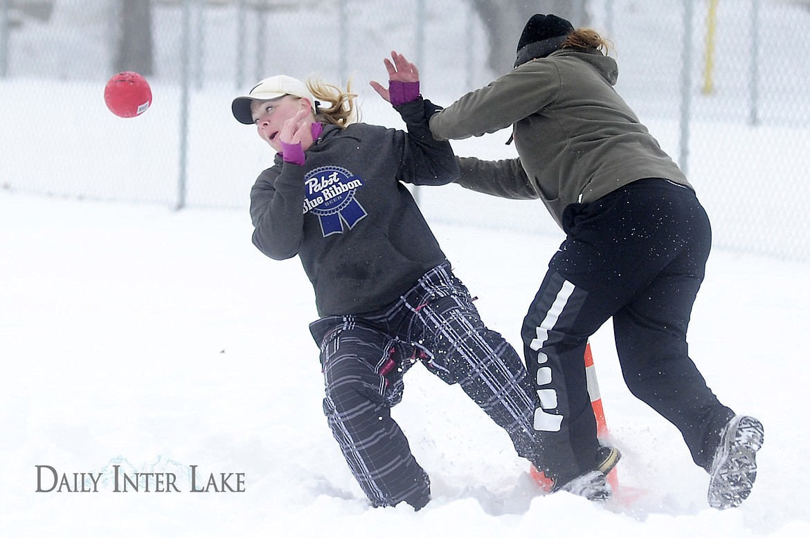 &lt;p&gt;Heidi Morton, left, falls to the ground after being pushed by Shelley Burton during a play at first base. (Aaric Bryan/Daily Inter Lake&lt;/p&gt;