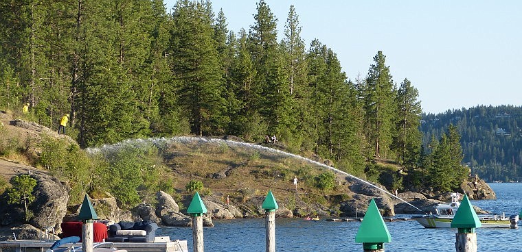 &lt;p&gt;Firefighters work to extinguish a small grass fire Thursday on Tubbs Hill in Coeur d'Alene.&lt;/p&gt;