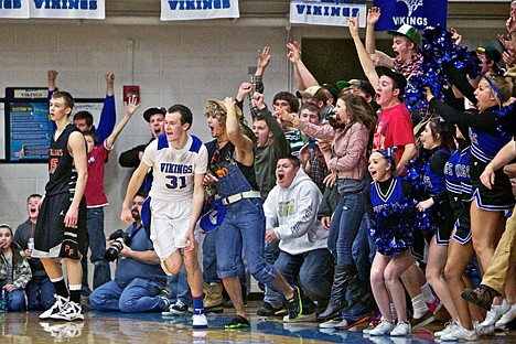 &lt;p&gt;Coeur d'Alene High students jump out of their seats Friday after Ty Higbie sunk the game-winning three point shot at the buzzer to end overtime with a 51-48 win over Post Falls.&lt;/p&gt;