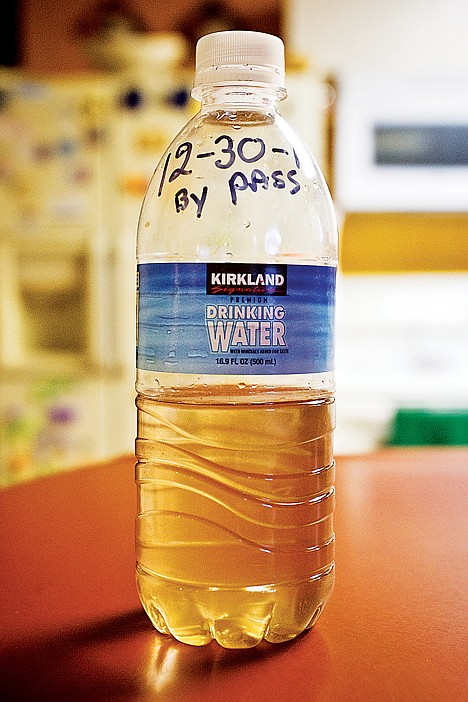 &lt;p&gt;A sample of water that the Brooks took from their tap shows discoloration even after a filtration system has been put into place.&lt;/p&gt;