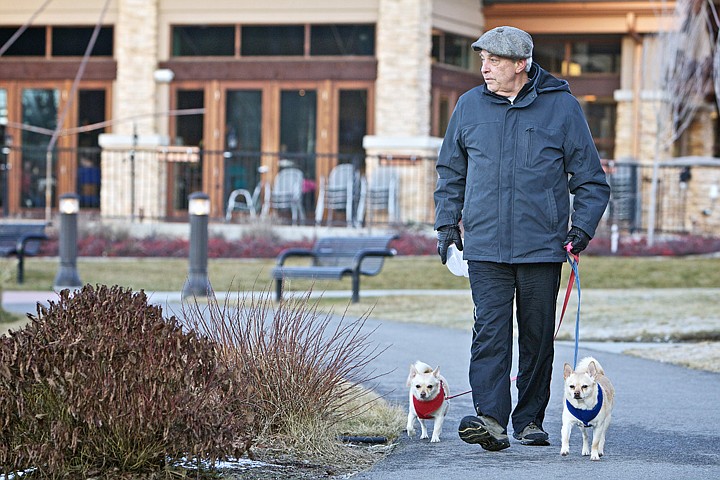 &lt;p&gt;JEROME A. POLLOS/Press David Albertini walks his two dogs around the Riverstone pond Monday as he looks out over the water.&lt;/p&gt;