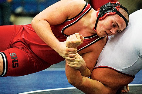 &lt;p&gt;Sandpoint High 220-pound wrestler Matt Lockey uses the arm of American Falls' Diego Cerna to gain an advantage. Lockey went on the win the championship match 5-3.&lt;/p&gt;