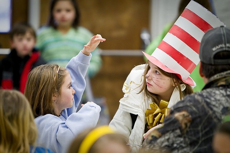 &lt;p&gt;JEROME A. POLLOS/Press Willow Smith, 8, sizes up Natasza Springer's hat she donned for Dr. Seuss' birthday celebration Tuesday at Bryan Elementary in Coeur d'Alene.&lt;/p&gt;