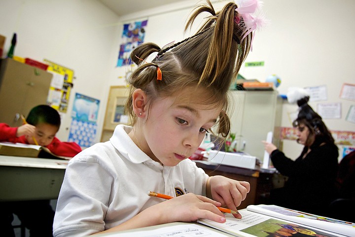 &lt;p&gt;JEROME A. POLLOS/Press Natalie Taylor, a first grade student in Joni Thurman's class at Classical Christian Academy, checks her work during Thursday where her class donned their best &quot;Whoville&quot; hairdos in honor of Dr. Seuss whose birthday which was Wednesday.&lt;/p&gt;