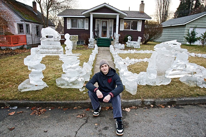 &lt;p&gt;JEROME A. POLLOS/Press Joe Roberts sits in front of his &quot;icescape&quot; he created in the front yard of his Garden Avenue home in Coeur d'Alene. Roberts used the leftover 6,000 pounds of ice from a recent display he helped craft for a New Year's Eve event to construct a bench, a few dinosaurs, an ice fence and other structures. &quot;We usually dump the ice in a field at a friend's property, but I thought it I'd do something with it,&quot; Roberts said. &quot;Kids walking home from Sorensen have stopped to look at it and I've had a few people slowing down to check it out.&quot;&lt;/p&gt;