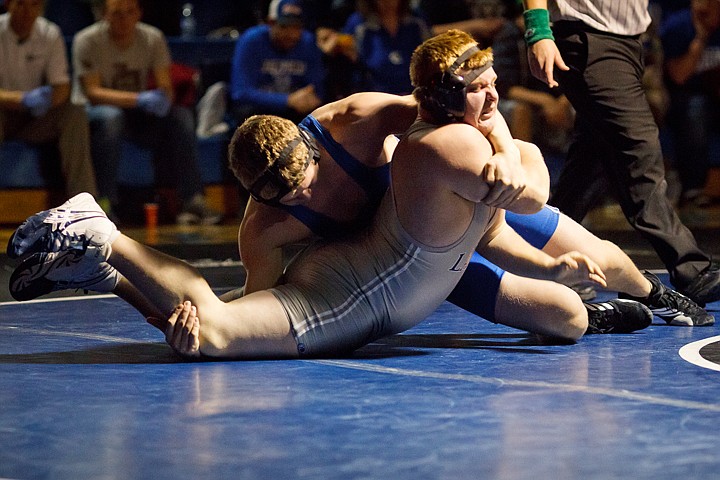 &lt;p&gt;SHAWN GUST/Press Lake City High's Austin Porter is bent backwards as Coeur d'Alene's Matt James applies pressure in the 285-pound match.&lt;/p&gt;