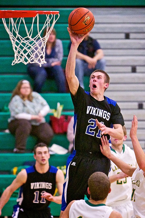 &lt;p&gt;JEROME A. POLLOS/Press Devon Loy from Coeur d'Alene High breaks through the Lakeland defense for a layup in the second half.&lt;/p&gt;