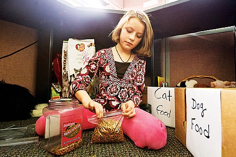 &lt;p&gt;Katie Weppner, 9, bags up cat food for the pets of homeless clients who works with the St. Vincent de Paul H.E.L.P. Center in Coeur d'Alene. The Winton Elementary fourth-grader has been raising funds and collecting donations to provide the food for approximately two years.&lt;/p&gt;