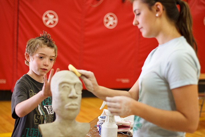 &lt;p&gt;Sheldon Raver, a second-grader at Atlas Elementary, reaches out to touch the head of a pirate sculpture as Lake City High art student Mariah Bell works on her piece Tuesday during the fourth annual Art Tour at the Hayden school. Some 20 artists demonstrated various mediums including painting, drawing, pottery and music.&lt;/p&gt;