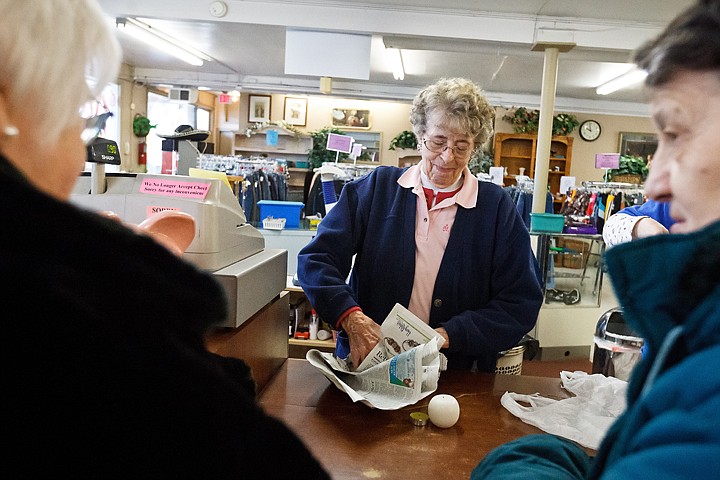 &lt;p&gt;SHAWN GUST/Press Minnie McDonald, a sales associate at the St. Vincent de Paul Thrift Store in Coeur d'Alene, wraps an item for a customer Wednesday during her shift. McDonald has worked at the shop for nearly 40 years.&lt;/p&gt;