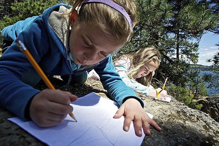 &lt;p&gt;&#160;Lucy Evans, right, and Johanna Gilbert, both 8, sketch the vista seen from their vantage point on Tubbs Hill during a May field trip to the recreation area with their second-grade class from Sorensen Magnet School. Students learned about water quality, native plants, conservation, art and the history of Tubbs Hill during the outing.&lt;/p&gt;