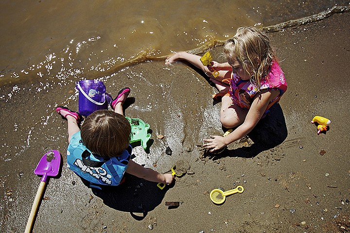 &lt;p&gt;Siryssa King,&#160;right, and Kendra Van Brunt, both 2, play on the shoreline of the Spokane River during an outing with their mothers Wednesday at Johnson Mill River Park. (JEROME A. POLLOS/Press)&lt;/p&gt;