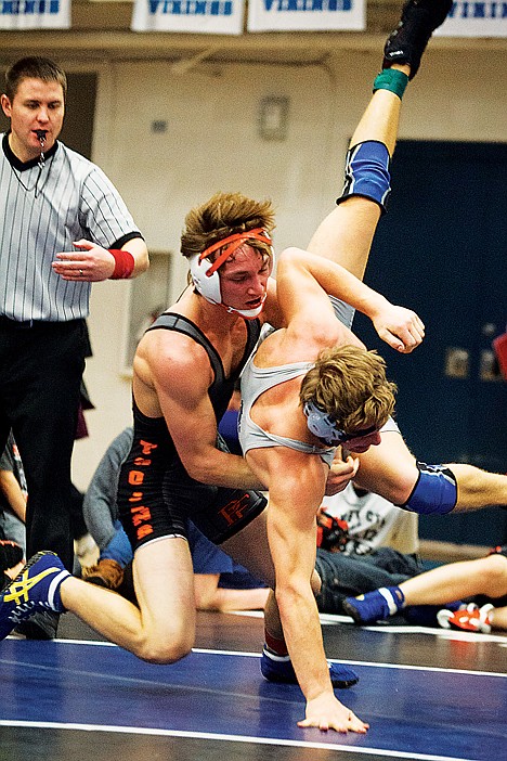 &lt;p&gt;Post Falls' Tyler Booth takes Nate Partenfelder, of Lake City, to the mat Saturday during the 152-pound finals match of the North idaho Rumble wrestling tournament in Coeur d'Alene.&lt;/p&gt;