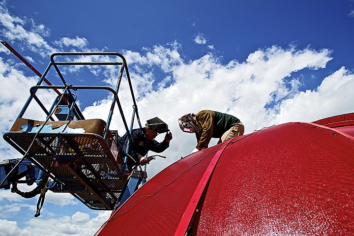 &lt;p&gt;JEROME A. POLLOS/Press Neal Gernert, left, and his son Tyson Gernert, with Diversified Services Incorporated, check their welding work as they repair screens on the firefighter's helmet playground feature Tuesday at the 9/11 Memorial Park in Coeur d'Alene. The screens on the overside helmet were damaged recently by vandals. &quot;With this being part of the 9/11 Memorial, you'd think people wouldn't mess with it,&quot; Tyson Gernert said.&lt;/p&gt;