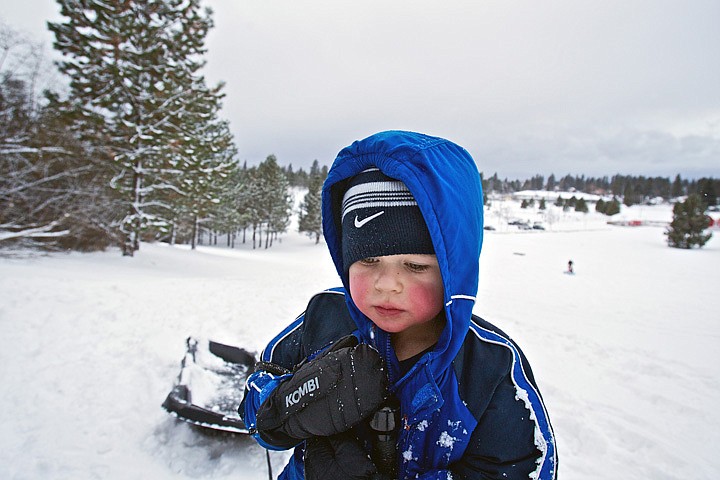 &lt;p&gt;JEROME A. POLLOS/Press&lt;/p&gt;
&lt;p&gt;Wyatt Josephson, 3, follows behind his father and sister
determined to pull his sled up Cherry Hill by himself during an
outing Tuesday at the popular sledding hill in Coeur d'Alene.&lt;/p&gt;