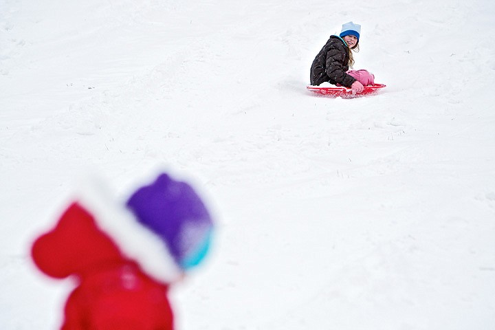 &lt;p&gt;JEROME A. POLLOS/Press Kelsey Sonius, 10, speeds to the bottom
of Cherry Hill on her sled Tuesday another sledder makes their way
up the popular sledding hill in Coeur d'Alene.&lt;/p&gt;