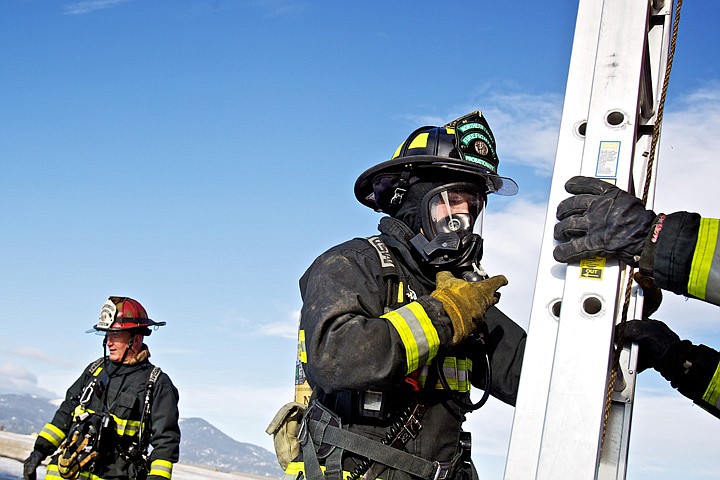 &lt;p&gt;Northern Lakes firefighter Cody Moore helps set up a ladder
before the start of a practice routine inside the fire department's
training tower Wednesday under the supervision of Lt. Mike Mather
at the Coeur d'Alene Airport.&lt;/p&gt;