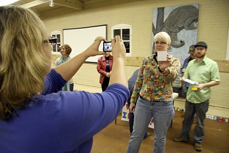 &lt;p&gt;Rachel Maughan, director of marketing at the Human Rights Education Institute, takes a picture of Laurie Hassell with her note supporting the Add the Words campaign.&lt;/p&gt;