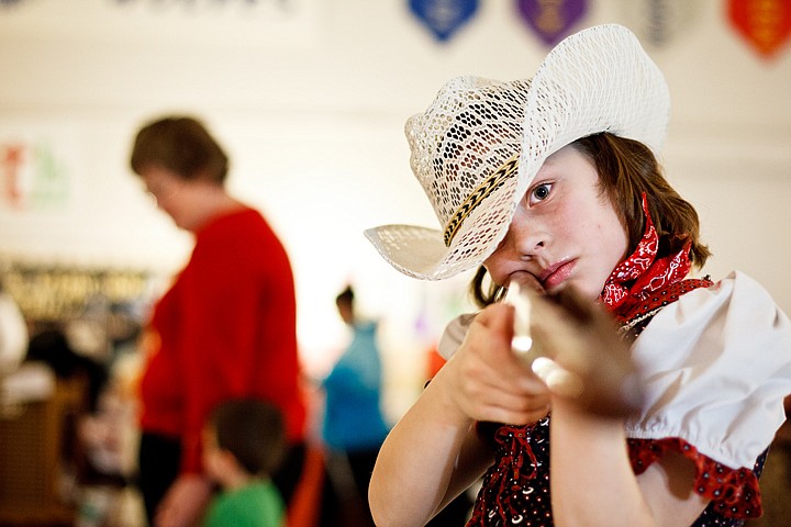 &lt;p&gt;SHAWN GUST/Press Kate Weppner holds a firing pose Tuesday while portraying Annie Oakley during a faux wax museum at Winton Elementary in Coeur d'Alene.&lt;/p&gt;