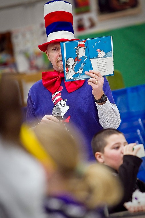 &lt;p&gt;JEROME A. POLLOS/Press Joel Palmer, principal of Bryan Elementary, shows the illustration for the &quot;Cat in the Hat&quot; while reading to his students at breakfast in his own Cat in the Hat attire.&lt;/p&gt;