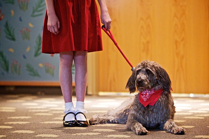 &lt;p&gt;JEROME A. POLLOS/Press Gus, playing the canine companion to the
lead character in the Christian Youth Theater production of
&quot;Annie&quot;, relaxes as Kiara Klinkefus, 12, discusses her experiences
in the play Wednesday with children at the Coeur d'Alene Public
Library. The play opens Friday at the Kroc Center and will run
through March 4.&lt;/p&gt;