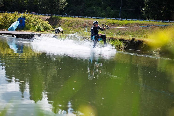 &lt;p&gt;&#160;Daryl Reynolds, of Post Falls, lands after performing a stunt after sliding across a wooden rail Monday while wake boarding via a vehicle mounted cable system near Blackwell Island. (SHAWN GUST/Press)&lt;/p&gt;