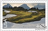 Park artwork on postage stamp and annual pass