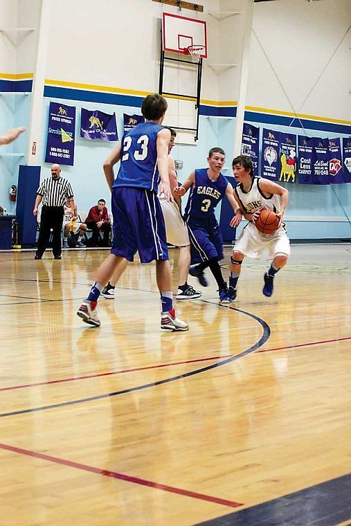 The Lions Austin Ray takes advantage of a screen set by his teammate in the game against Soap Lake Tuesday. The Eagles beat MLCA.