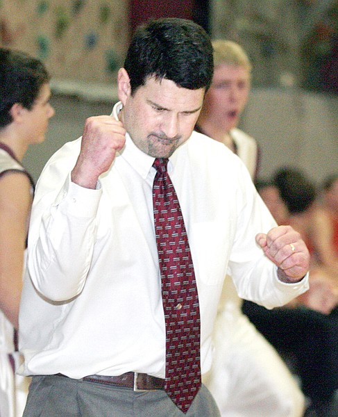 Troy boys basketball coach Cory Andersen reacts to his team defeating Eureka, 65-64, on Friday night.