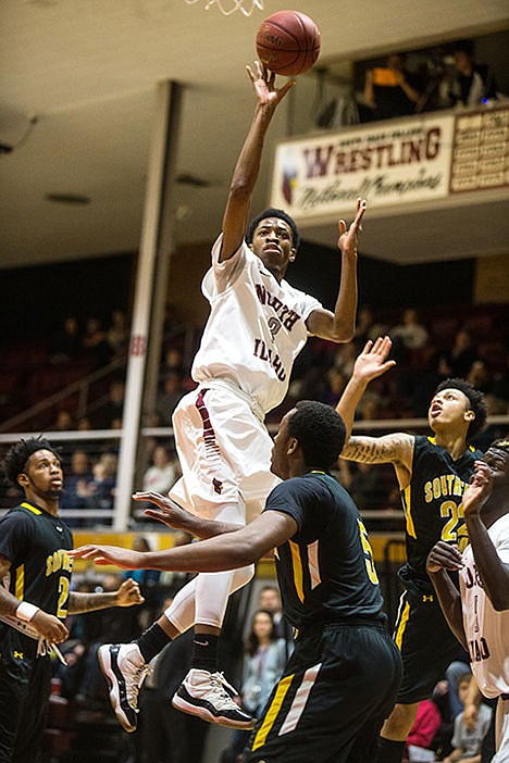 <p>North Idaho Colleges Djuan Piper shoots against College of Southern Idaho defenders in the first period of the game on Saturday evening. Southern Idaho College defeated North Idaho College 80-72.</p>