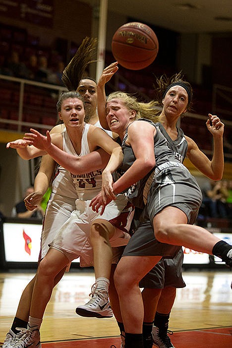 <p>North Idaho Colleges Monica Landeck, front, and Panisesi Taimani fight College of Southern Idahos Samantha Lubke, front, and Holly Blades for the ball in the first period of game on Saturday afternoon.</p>