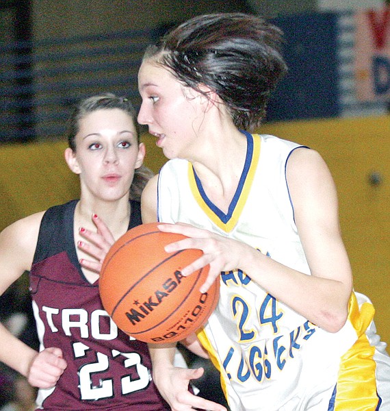 Libby’s Jaime Gilden drives on Troy’s Michaela Curry during Thursday’s game. Gilden scored a game-high 22 points.