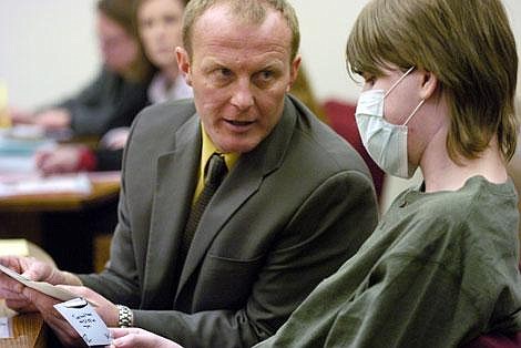 Defense attorney Thane Johnson talks with Kenton Weimer during Weimer&#146;s sentencing hearing Thursday afternoon in Flathead County District Court for the mitigated deliberate homicide in the May 1 death of 18-year-old Tarisia Caron of Evergreen. Weimer is holding a note he had written which read, &#147;Turn back time and I&#146;d kill her again.&#148; Weimer was sentenced to 40 years in prison and will not be eligible for parole for 20 years. Jennifer DeMonte/Daily Inter Lake