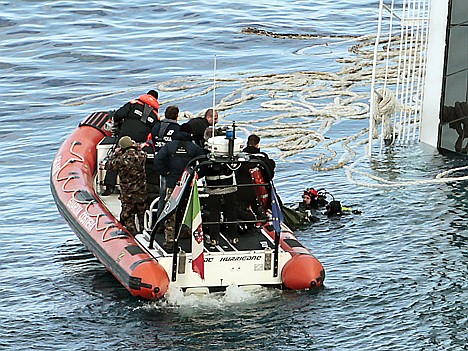 &lt;p&gt;FILE - In this Tuesday, Jan. 17, 2012 file photo, Italian naval divers recover a body from the cruise ship Costa Concordia. The $450 million ship was carrying more than 4,200 passengers and crew when it slammed into a reef on Friday, Jan. 13, following an unauthorized maneuver by the captain. (AP Photo/Gregorio Borgia)&lt;/p&gt;