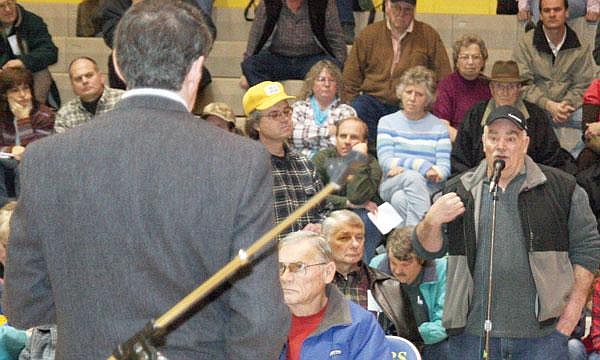 Brad Fuqua/The Western News U.S. Rep. Denny Rehberg, left, listens to Libby resident Charlie Decker on Saturday afternoon at Ralph Tate Gymnasium on the campus of Libby High School.