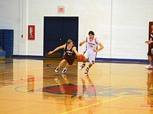 Brandon Lehl pushes the ball out away from a Bobcat defender during a game last week. Alberton ended up winning despite the fact they didn't score in the first quarter.