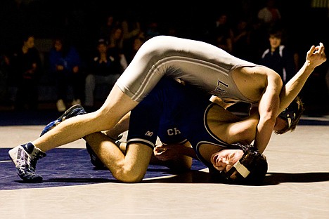 &lt;p&gt;Lake City's Michael Carr, top, puts a half nelson on Coeur d'Alene's Kyle White in the 132-pound weight class.&lt;/p&gt;