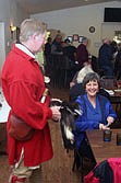 Paul Fielder passes the hat to attendee Deb Oliver at the fundraiser. Fielder dressed in the garb of explorer David Thompson's era for the event. The park is planned to be built in a frontier theme, speaking to the heritage of the town.