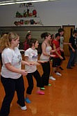 Tia Thompson, Felicia Earhart, Cami Newman and Keri Sanzo participate in a zumba dance at an Upward Bound event at the Plains High School Saturday morning. The event taught students what they can do to stay fit as they make the transition to college life.