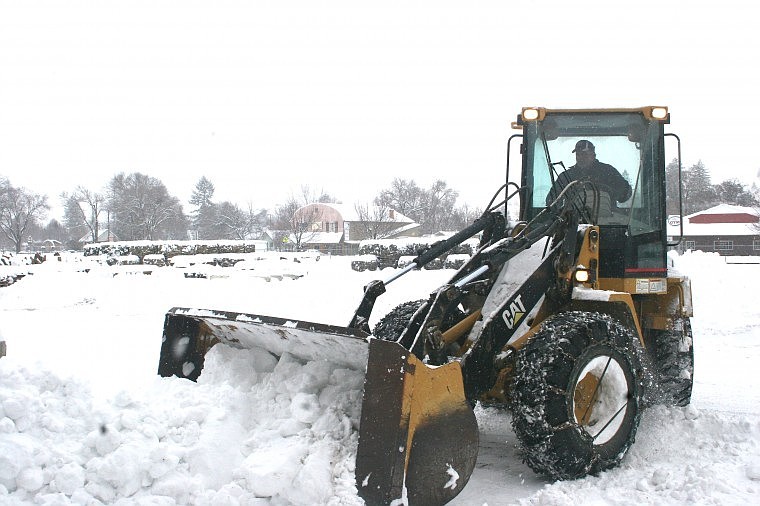 &lt;p&gt;Batt Lulack of Plains plows snow off of Lynch Street Thursday
morning while snow continues to fall and bury the Town of Plains
after months of a winter dry spell.&lt;/p&gt;