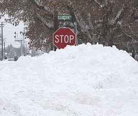 &lt;p&gt;&#160;A large pile of accumulated snow nearly engulfs a stop sign on
Clayton Street in Plains Thursday.&lt;/p&gt;